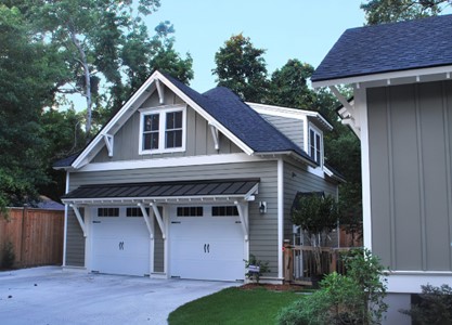 A garage with a living space built above the vehicle parking area. This is an example of an ADU that is attached to an accessory structure.