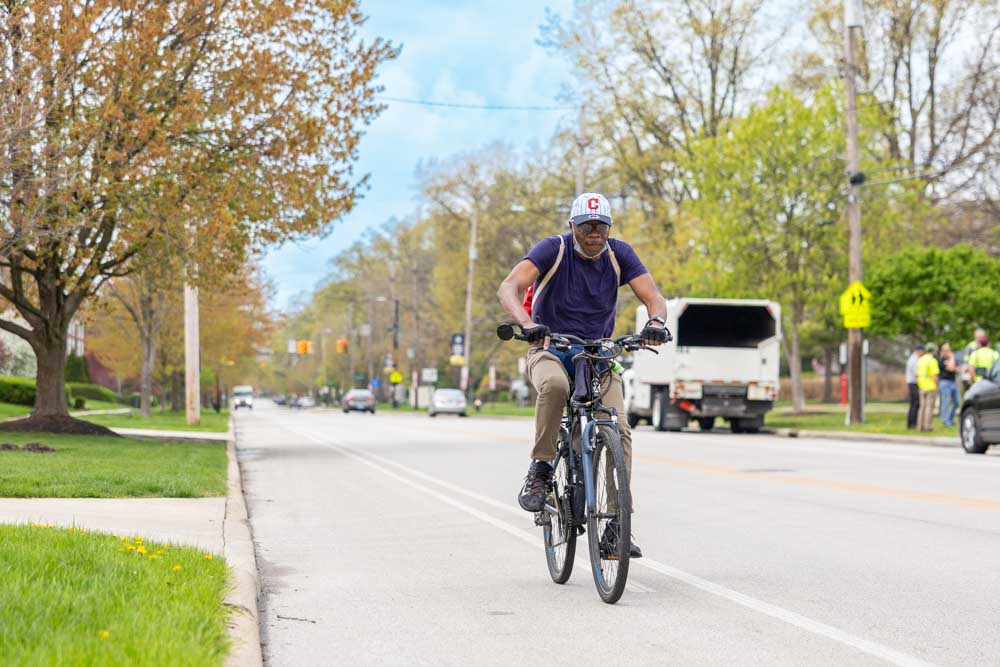 A cyclist rides on a bike path down Lake Ave. in Lakewood.